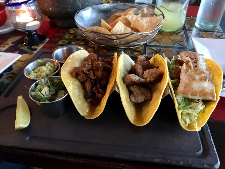 Tequiztlan Mexican Restaurant and Tequila Bar signature dishes Queso en CazuelaTamalesTaco Maria Sabina